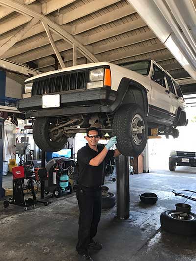 A mechanic working on a vehicle